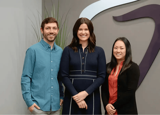     Waukee Dental dentists Dr. Kellen Bohn, Dr. Kaisha Heemskerk, and Dr. Jean Kim smiling together. 